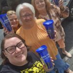 UCHRA Public Transportation employees pose with blue tumblers, featuring the UCHRA Public Transportation logo.